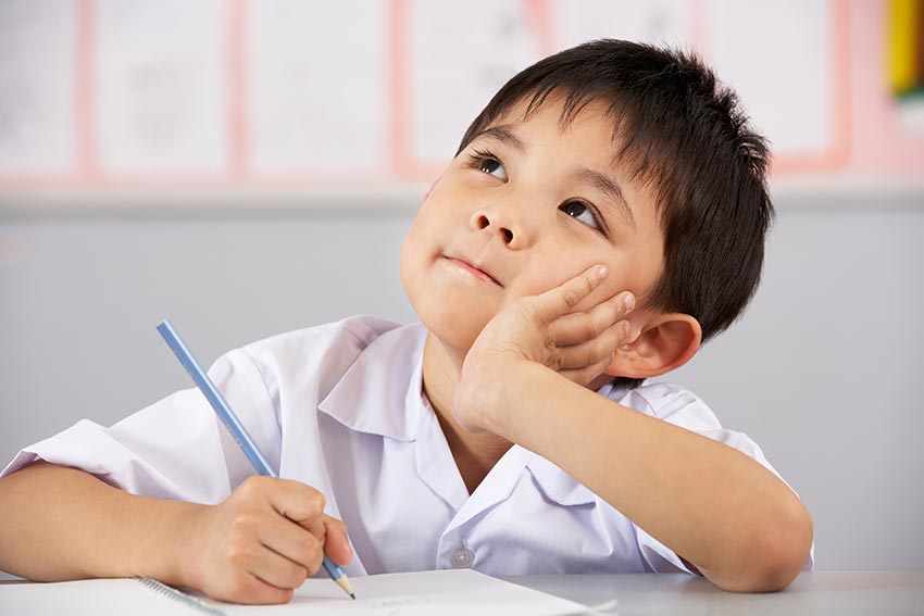 asian child thinking about spelling